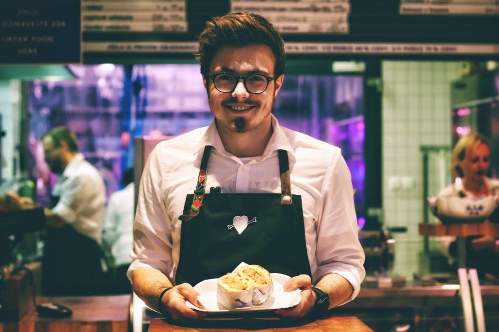 hospitality worker holding plate